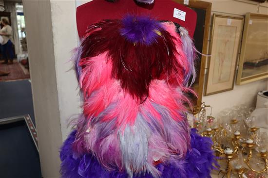 The Magic Flute: Papagenas pink, lilac and purple bodice with matching feather skirt and feathered bird headdress,